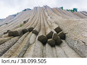 Basalt columns forming a coastal rock at Cape Stolbchaty on Kunashir Island, close-up. Стоковое фото, фотограф Евгений Харитонов / Фотобанк Лори