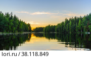 Lake at sunset with reflection of trees in the water. Стоковое фото, фотограф Михаил Аккуратoв / Фотобанк Лори
