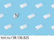 Protective masks on blue background. Trendy pattern. Surgical mask. Concept of exclusiveness, uniqueness. Trendy isometric pattern. Стоковое фото, фотограф Эдуард Слободянюк / Фотобанк Лори
