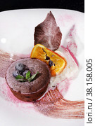 Chocolate flan with vanilla ice cream on a white plate. Стоковое фото, фотограф Марина Володько / Фотобанк Лори