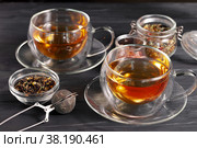 Black tea in cup on the table. Стоковое фото, фотограф Сергей Толмачёв / Фотобанк Лори