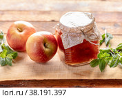 Full small glass jar with  apple jam and two apples and green mint on wooden background. Стоковое фото, фотограф Наталья Семкина / Фотобанк Лори
