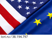 Closeup of Flags of USA and European Union lying together on table. Стоковое фото, фотограф Сергей Толмачёв / Фотобанк Лори