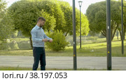 Inspector in business suit checking the manhole cover. Стоковое видео, видеограф Chudakov_Ivan / Фотобанк Лори