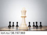 One chess pieces staying against thel set of chess pieces. Strategy, business concept. Стоковое фото, фотограф Сергей Толмачёв / Фотобанк Лори