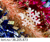 Snowflake on the background of multi-colored tinsel. Стоковое фото, фотограф Irina Opachevsky / Фотобанк Лори