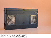 Old black vintage vhs cassette tape, cut out 80s, 90s retro media aesthetic, magnetic videotape movie storage concept studio shot. Стоковое фото, фотограф Ирина Старикова / Фотобанк Лори