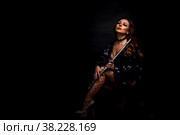Flute player. Flutist with flute instrument. Pretty actress in stage costume with beautiful Golden hair and cleavage. Cute Girl with flute. Classic female musician isolated on black background. Стоковое фото, фотограф Aleksandr Golubev / Фотобанк Лори