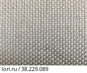 Grey fabric texture. Selective focus, close-up shot of light gray fabric upholstery. Fibrous structure of wool. Colorful design. Wallpaper and background with space for copying text. Стоковое фото, фотограф Aleksandr Golubev / Фотобанк Лори