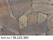 Textured stone background with cement elements. Fragment of wall or sidewalk made of rubble. Design space made of vintage chipped stone. Space for your label, signature, or logo. Стоковое фото, фотограф Aleksandr Golubev / Фотобанк Лори