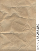 Текстура мятой коричневой оберточной бумаги для рукоделия для фона. Crumpled brown wrapping craft paper texture for background. Стоковое фото, фотограф Марина Шабардина / Фотобанк Лори