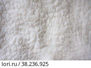 Белый фон из мягкой шерсти, деталь коврика из натуральной овчины мериноса. White soft wool background, detail of a natural merinosheepskin rug. Стоковое фото, фотограф Марина Шабардина / Фотобанк Лори