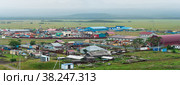 Aerial view of the industrial zone of the village of Yuzhno-Kurilsk on the island of Kunashir (2022 год). Редакционное фото, фотограф Евгений Харитонов / Фотобанк Лори