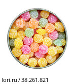 Colorful multicolored sucking sweets Montpensier lollipops in a round tin box isolated on a white background close-up top view flat lay. Стоковое фото, фотограф Андрей С / Фотобанк Лори