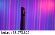 Sofia, Bulgaria-05 11 2022: vertical video hand holding phone with green screen abstrack neon floral background. Стоковое видео, видеограф Mihail Mihaylov / Фотобанк Лори
