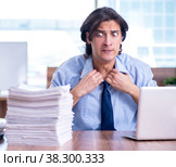 Young employee unhappy with excessive work. Стоковое фото, фотограф Elnur / Фотобанк Лори