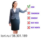 Concept of procrastination with now or later. Стоковое фото, фотограф Elnur / Фотобанк Лори
