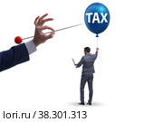 Businessman in tax balloon concept. Стоковое фото, фотограф Elnur / Фотобанк Лори