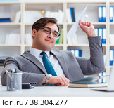 Businessman with paper airplane in office. Стоковое фото, фотограф Elnur / Фотобанк Лори