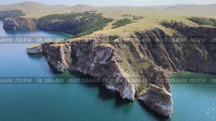 Aerial view on cape Sagan-Khushun on Olkhon island. Summer landscape of lake Baikal. (2022 год). Редакционное видео, видеограф Mixail59 / Фотобанк Лори