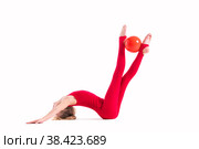 Gymnast girl in a red jumpsuit does an exercise with ball on white background, isolate. Стоковое фото, фотограф Мария Мороз / Фотобанк Лори