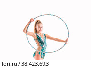 A gymnast girl in an emerald swimsuit performs an exercise with a hoop isolated on a white background. Стоковое фото, фотограф Мария Мороз / Фотобанк Лори