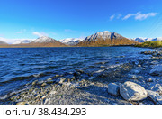 Landscape Big Vudyavr Lake  in the Hibiny mountains. The mountains are covered with snow. Стоковое фото, фотограф Михаил Аккуратoв / Фотобанк Лори