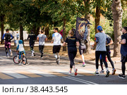 Marathon race. Marathon race of people athletes on the road in the city park. Running people at marathon competitions. Gorky Park, Moscow, Russia, September 2022. Редакционное фото, фотограф Photojuli / Фотобанк Лори