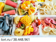 Ассорти - смешанные сорта сушеных макаронных изделий на деревянном фоне. Фон из макаронных изделий твердых сортов пшеницы. Стоковое фото, фотограф Оксана Медведева / Фотобанк Лори