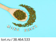 Mung beans in wooden spoon on a green background. Стоковое фото, фотограф Виктория Тельминова / Фотобанк Лори