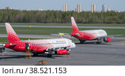 Два самолета авиакомпании Rossiya на летном поле аэропорта Пулково солнечным майским днем. Санкт-Петербург (2022 год). Редакционное фото, фотограф Виктор Карасев / Фотобанк Лори