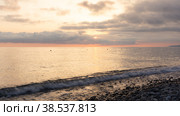 Amazing beach sunset over Black Sea. Lazarevskoye, Sochi, Russia. Стоковое фото, фотограф Tae Mi / Фотобанк Лори