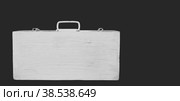 An old suitcase with a handle. Стоковое фото, фотограф Siarhei Starastau / Фотобанк Лори
