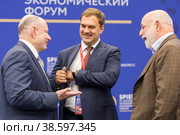 Russia. Saint-Petersburg. XXIII St. Petersburg International Economic Forum 2019. SPIEF 2019 participants. Russian entrepreneur Vladimir Potanin, CEO of ANO Digital Economy Evgeny Kovnir and Chairman of the Board of Directors of Renova Viktor Vekselberg. Россия. Санкт-Петербург. XXIII Петербургский международный экономический форум 2019. Участники ПМЭФ-2019. Российский предприниматель Владимир Потанин, генеральный директор АНО Цифровая экономика Евгений Ковнир и председатель совета директоров компании Ренова Виктор Вексельберг. Редакционное фото, фотограф Алексей Смышляев / Фотобанк Лори