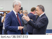 Russia. Saint-Petersburg. XXIII St. Petersburg International Economic Forum 2019. SPIEF 2019 participants. Moscow Mayor Sergei Sobyanin and Deputy Prime Minister of the Russian Federation Vitaly Mutko. Россия. Санкт-Петербург. XXIII Петербургский международный экономический форум 2019. Участники ПМЭФ-2019. Мэр Москвы Сергей Собянин и заместитель председателя правительства Российской Федерации Виталий Мутко. Редакционное фото, фотограф Алексей Смышляев / Фотобанк Лори