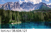 Bleu lake in the dolomites Italy, Carezza lake Lago di Carezza, Karersee with Mount Latemar. Стоковое фото, фотограф Fokke Baarssen / Фотобанк Лори