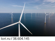 Wind turbine from aerial view, Drone view at windpark westermeerdijk a windmill farm in the lake IJsselmeer the biggest in the Netherlands,Sustainable development, renewable energy. Стоковое фото, фотограф Fokke Baarssen / Фотобанк Лори