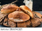 Russian national bread Kalach on a wooden background. National bread products. Стоковое фото, фотограф Оксана Медведева / Фотобанк Лори