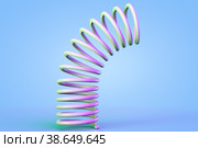 Plastic spring bends against blue background. Стоковое фото, фотограф Happyphotons / Фотобанк Лори
