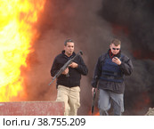 Сотрудники нефтяной полиции в бронежилетах с автоматами (2012 год). Редакционное фото, фотограф Vadim Ilin / Фотобанк Лори