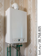 New modern white gas boiler on the wall. Стоковое фото, фотограф Радомир Тарасов / Фотобанк Лори