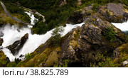 Panoramic view to kleivafossen waterfall at briksdalselva river, Briksdalsbreen glacier, Norway (2017 год). Стоковое фото, фотограф Сергей Майоров / Фотобанк Лори