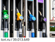 Filling column with pistols with different types of fuel at the lukoil gas station (2022 год). Редакционное фото, фотограф FotograFF / Фотобанк Лори