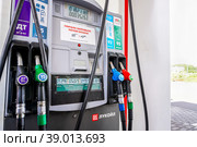 Filling column with pistols with different types of fuel at the lukoil gas station (2022 год). Редакционное фото, фотограф FotograFF / Фотобанк Лори