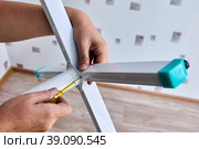 Installation of floor fan, rack assembly in form of cross. Стоковое фото, фотограф Владимир Григорьев / Фотобанк Лори