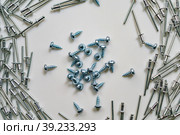 Image of scattered rivets and screws. Стоковое фото, фотограф Siarhei Starastau / Фотобанк Лори