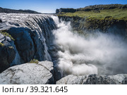 Amazing Iceland landscape at Dettifoss waterfall in Northeast Iceland region. Dettifoss is a waterfall in Vatnajokull National Park reputed to be the most powerful waterfall in Europe. Стоковое фото, фотограф Igor Tichonow / Фотобанк Лори
