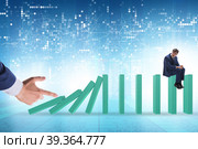 Businessman in domino effect concept. Стоковое фото, фотограф Elnur / Фотобанк Лори
