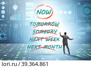 Concept of procrastination with now or later. Стоковое фото, фотограф Elnur / Фотобанк Лори