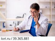 Young male doctor working in the clinic. Стоковое фото, фотограф Elnur / Фотобанк Лори